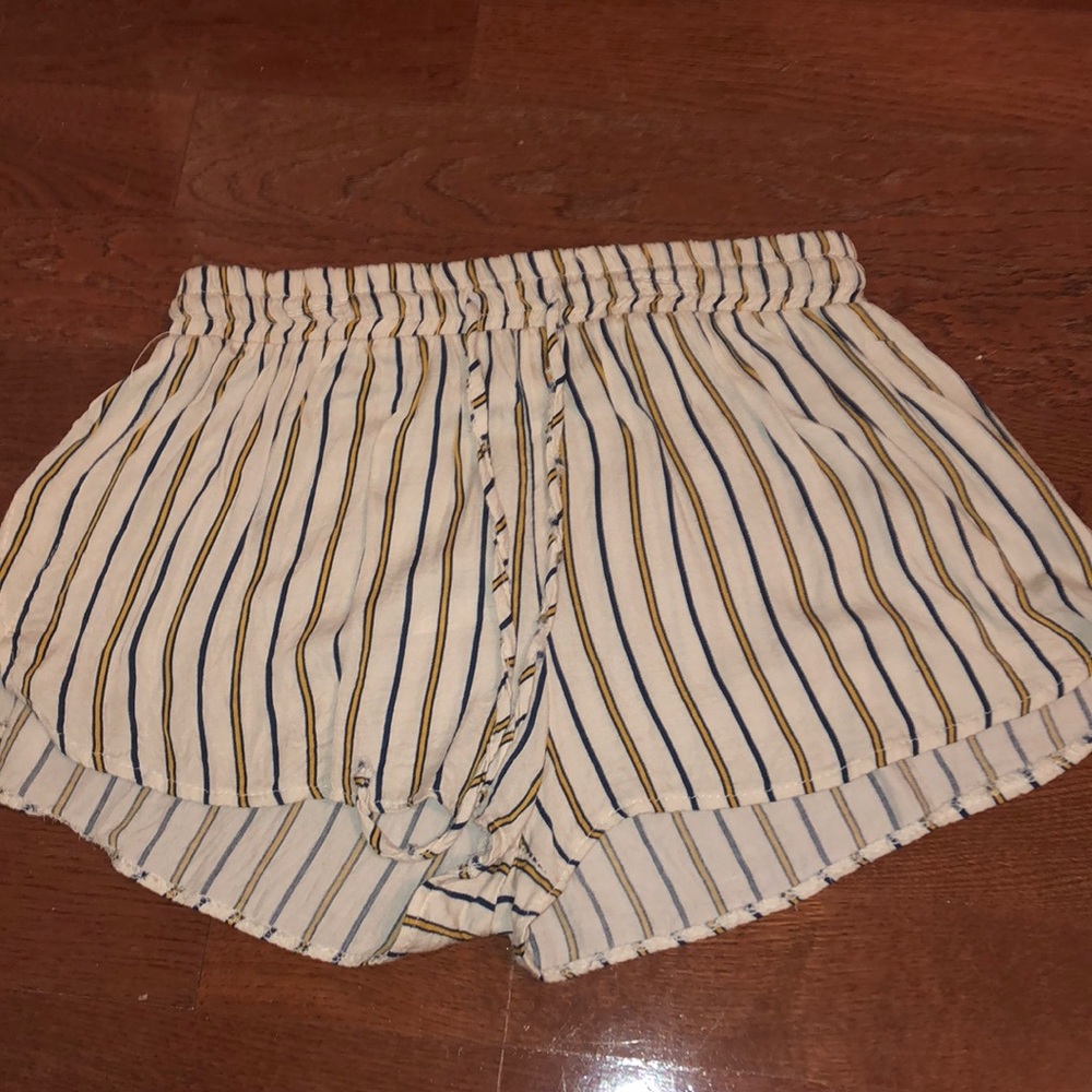 white shorts with blue and yellow stripes